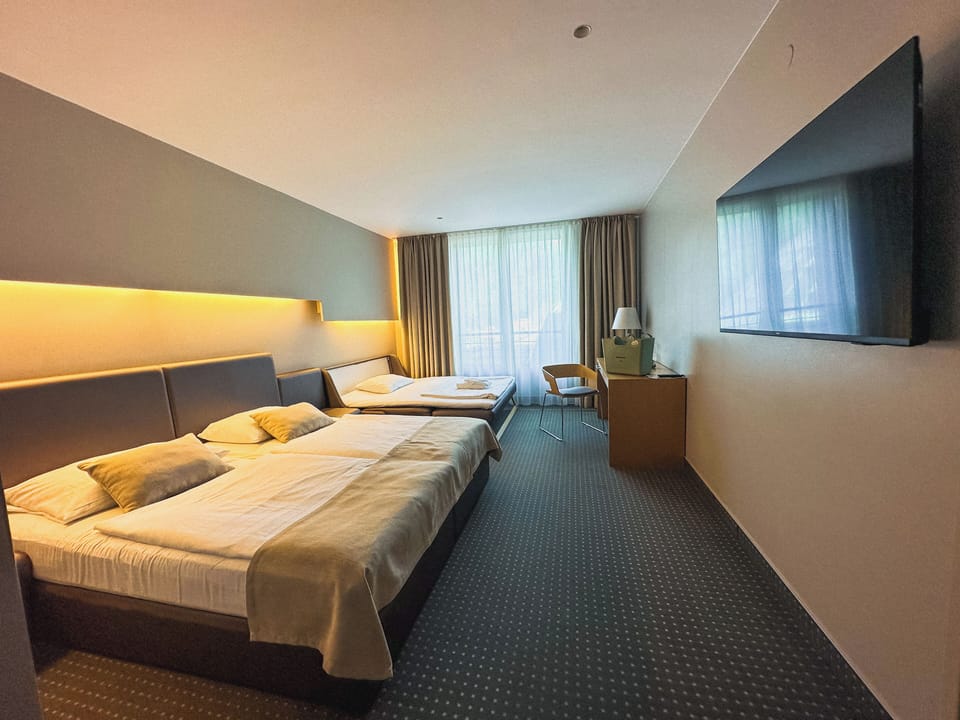 Double Room with Extra Bed | Minibar, in-room safe, desk, blackout drapes