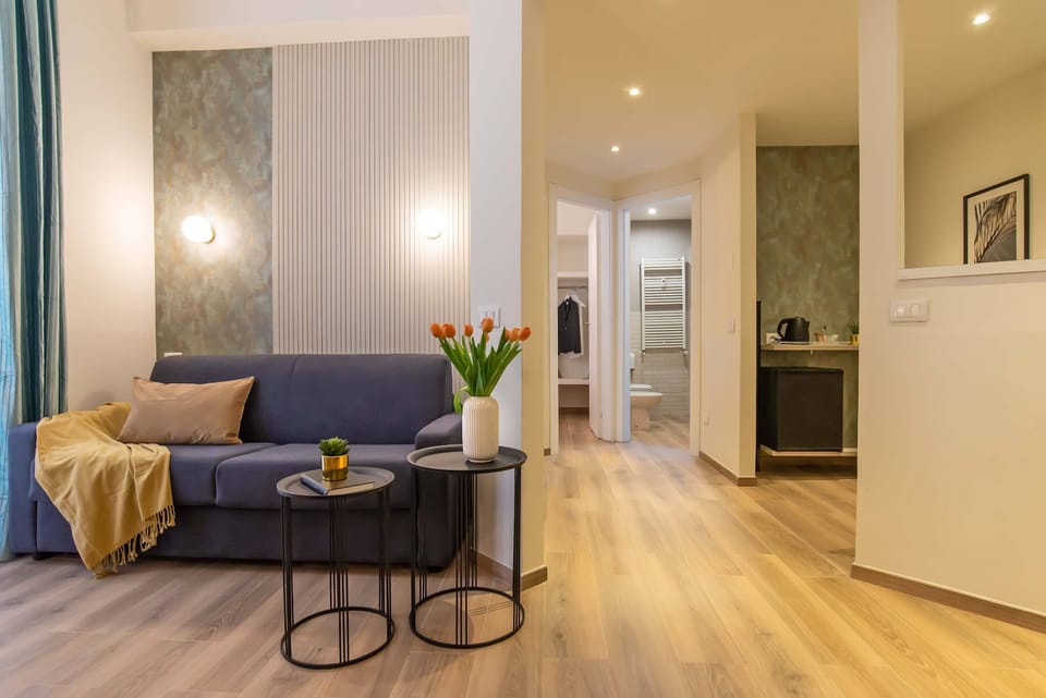 Family Suite (Via della Giuliana 18) | Living area | 30-inch LCD TV with digital channels, TV
