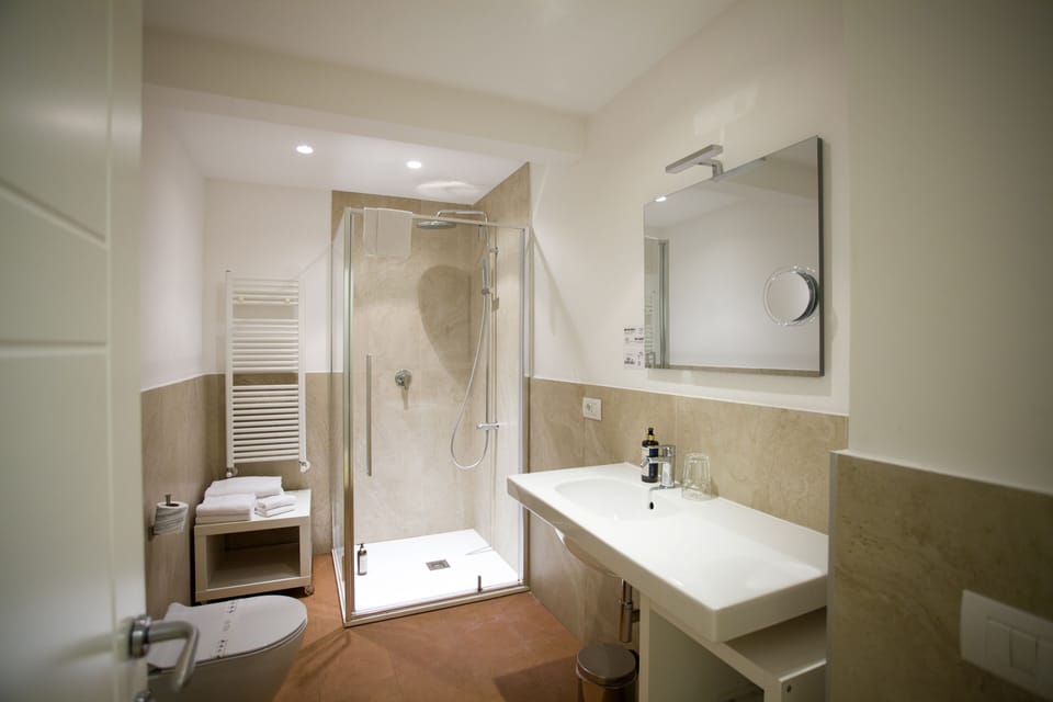Classic Triple Room | Bathroom | Designer toiletries, hair dryer, slippers, bidet