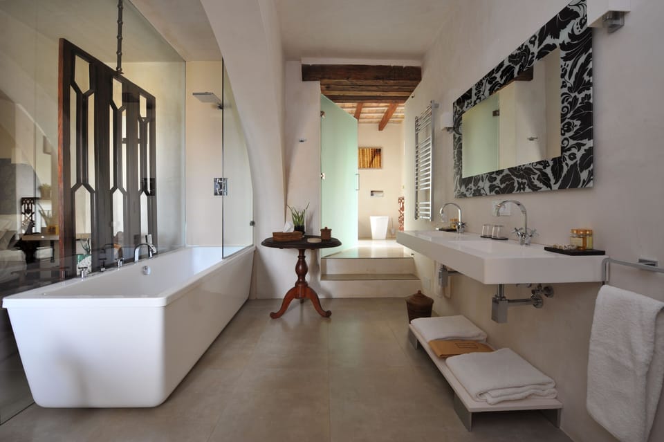 Designer toiletries, hair dryer, bathrobes, slippers