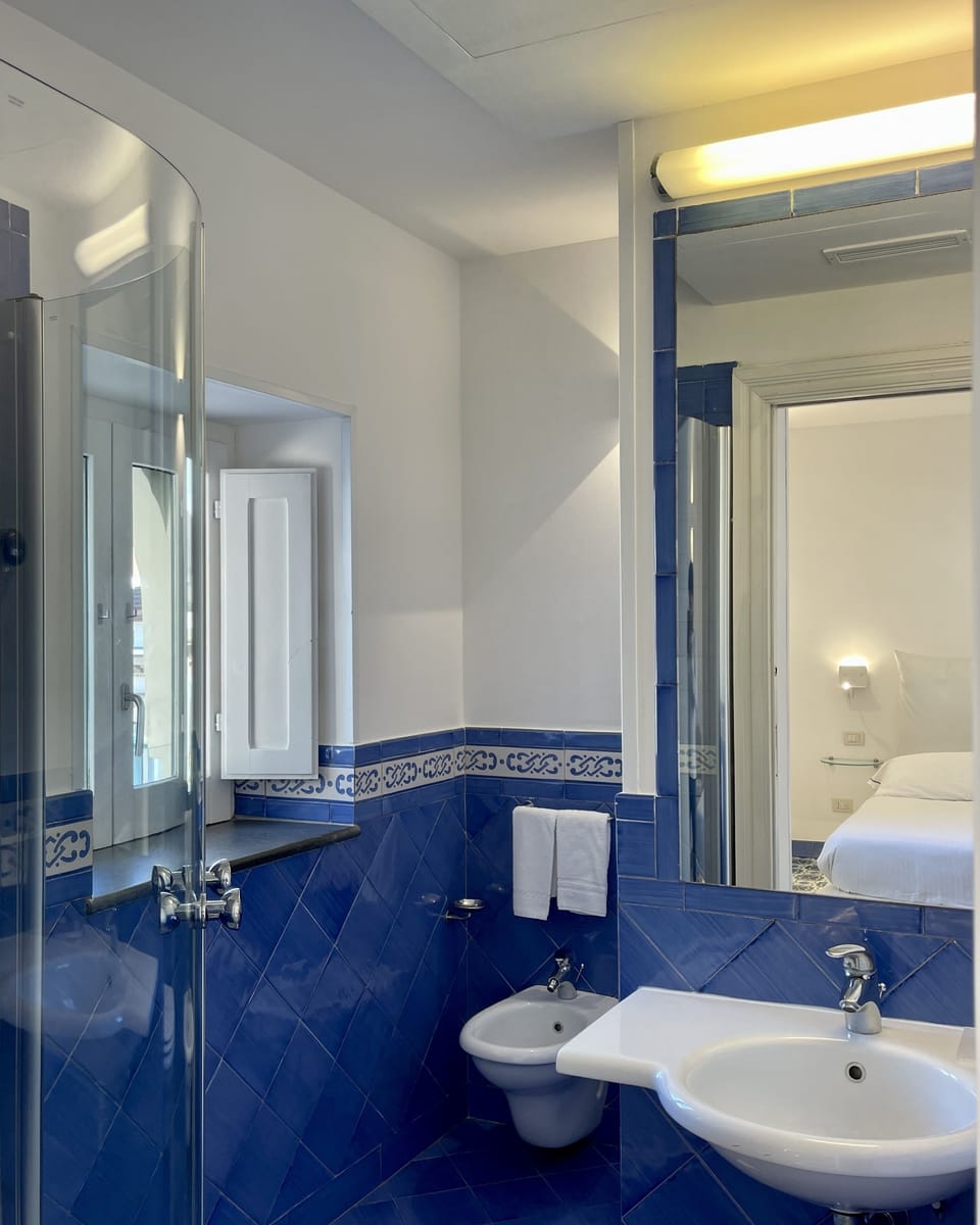 Shower, rainfall showerhead, free toiletries, hair dryer