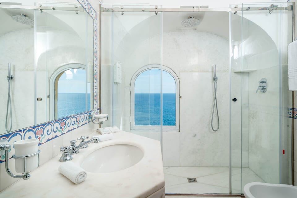 Junior Suite, Balcony, Sea View | Bathroom | Combined shower/tub, eco-friendly toiletries, hair dryer, bathrobes