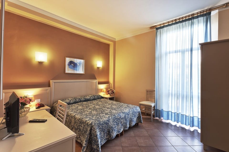 Double or Twin Room, Private Bathroom | In-room safe, desk, iron/ironing board, free WiFi