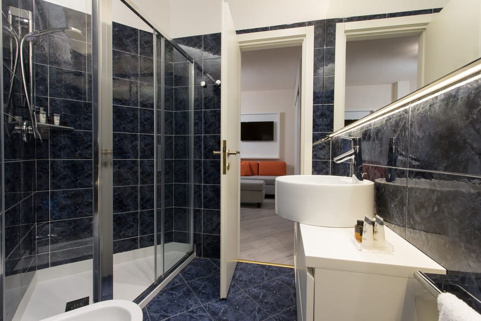 Double or Twin Room, Sea View (Elegance) | Bathroom | Shower, rainfall showerhead, free toiletries, hair dryer