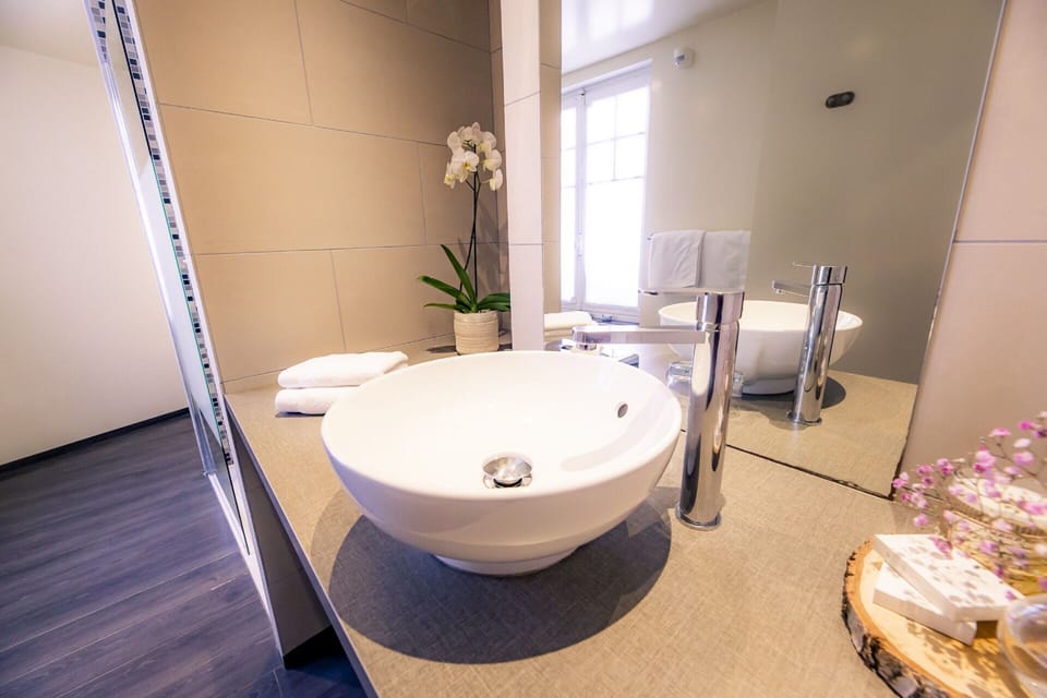 Family Room, 1 King Bed with Sofa bed | Bathroom | Free toiletries, hair dryer, bathrobes, slippers