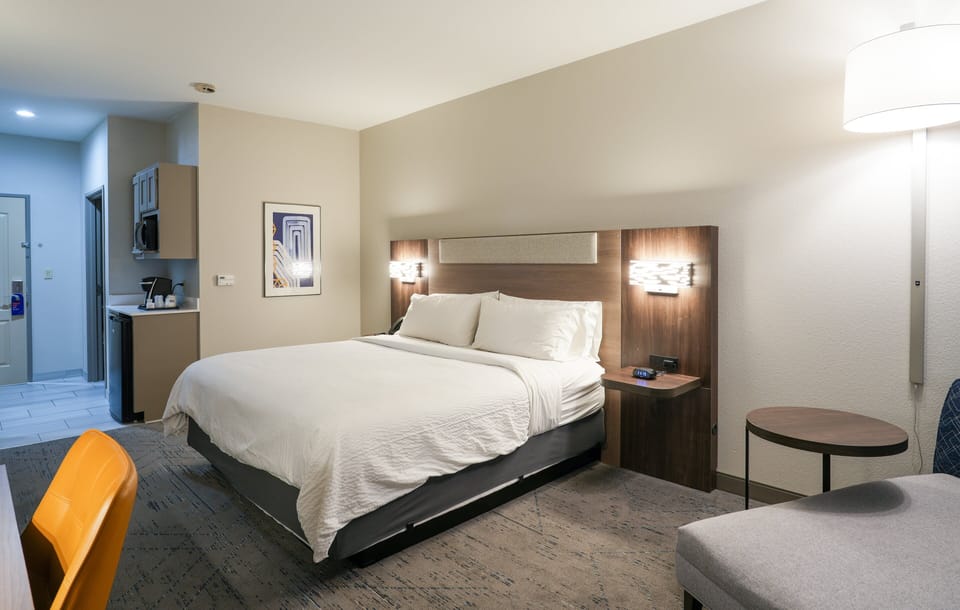Premium bedding, pillowtop beds, laptop workspace, blackout drapes