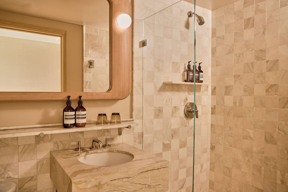 Shower, designer toiletries, hair dryer, bathrobes
