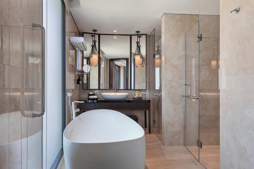 Family Room, 1 King Bed with Sofa bed, Garden View (Exclusive) | Bathroom | Separate tub and shower, deep soaking tub, rainfall showerhead