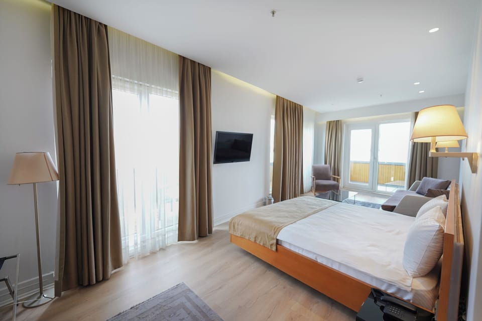 King Suite with Balcony | Premium bedding, down comforters, Select Comfort beds, minibar