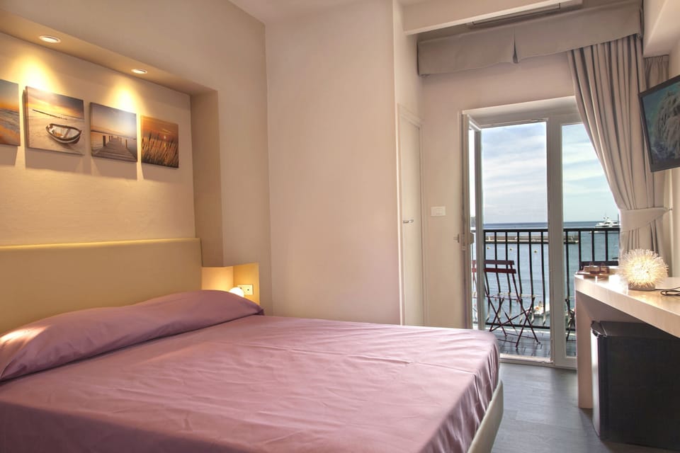 Quadruple Room, Balcony, Sea View | In-room safe, desk, free WiFi, bed sheets
