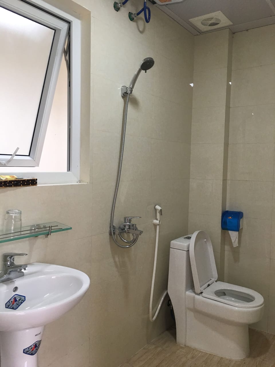 Shower, free toiletries, hair dryer, slippers