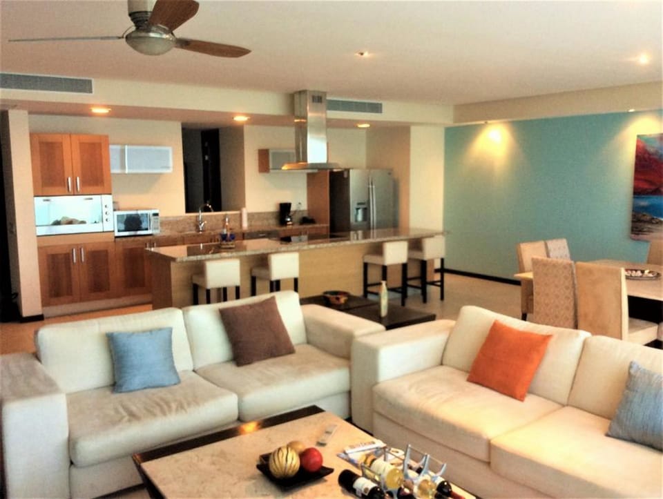 Comfort Condo, Kitchen, Ocean View | Living area | Flat-screen TV