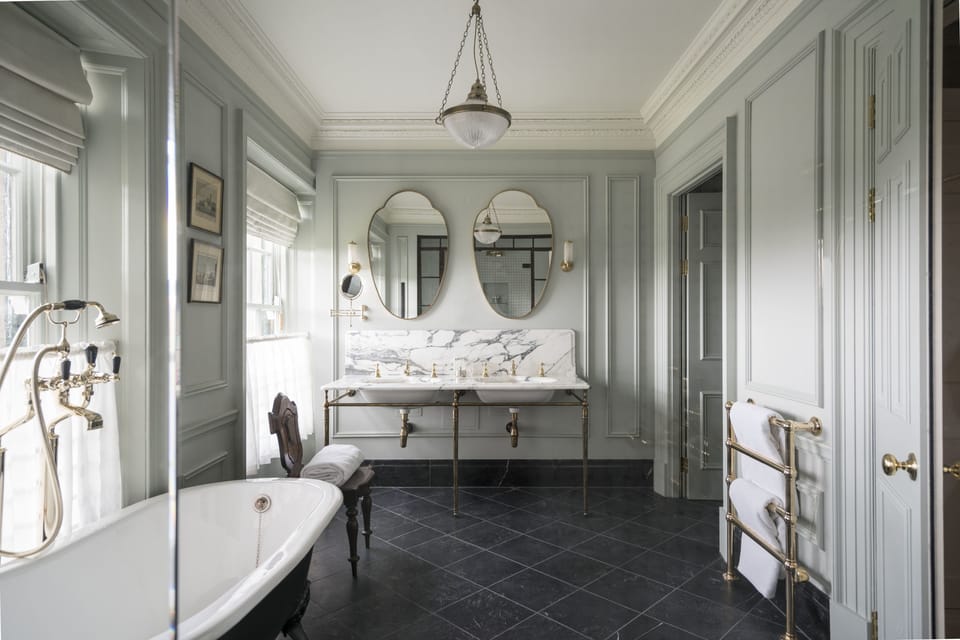 Combined shower/tub, designer toiletries, hair dryer, bathrobes