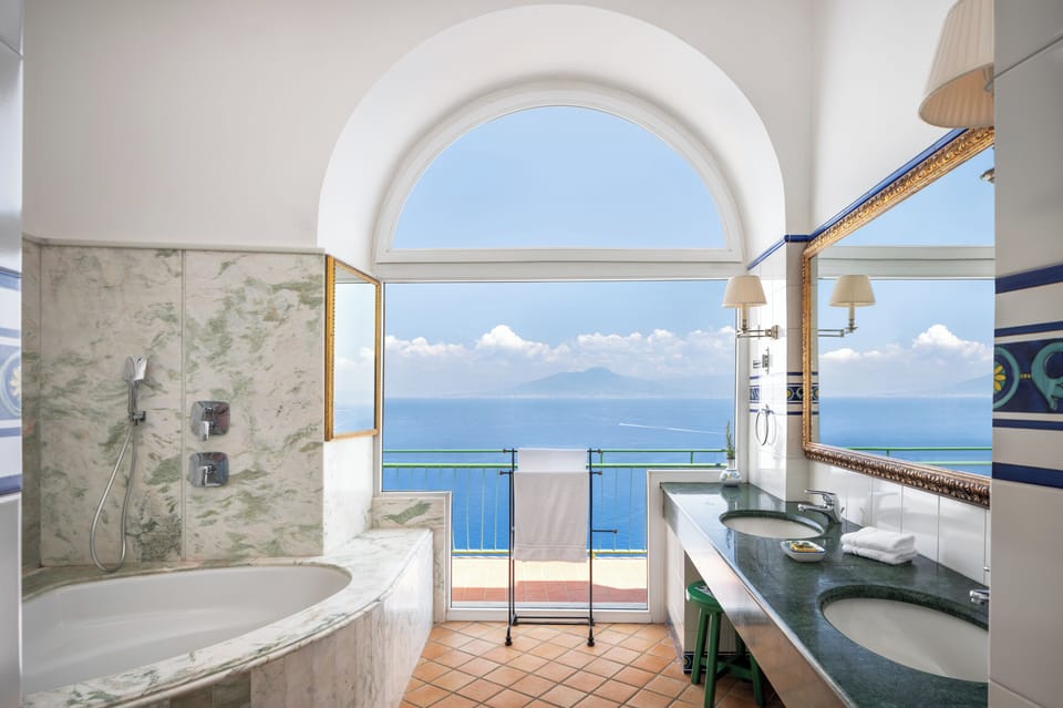 Designer toiletries, hair dryer, bathrobes, slippers