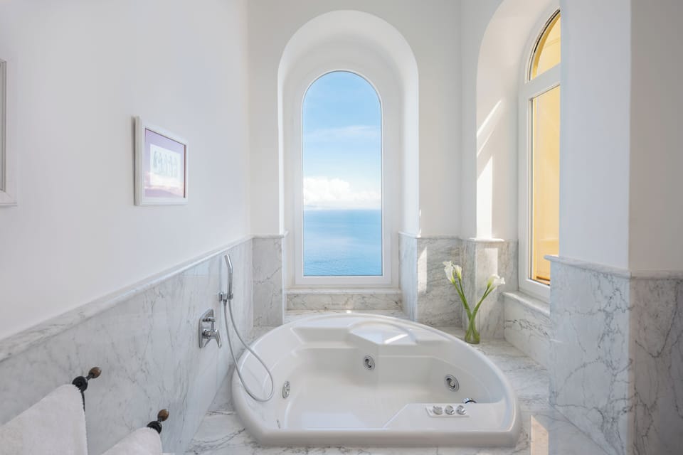 Designer toiletries, hair dryer, bathrobes, slippers