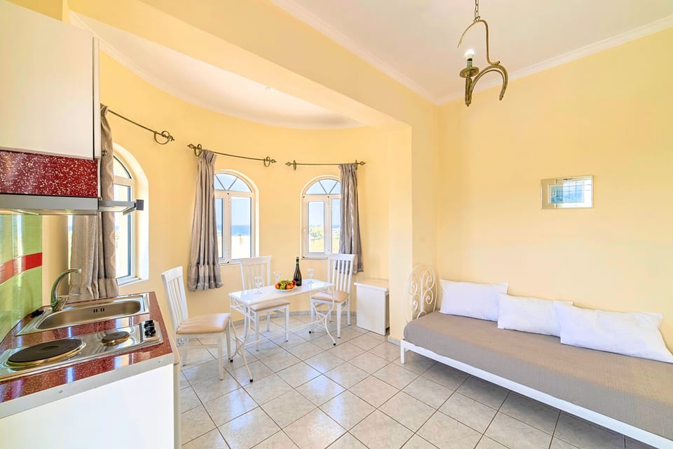 Suite, Sea view | Living area | Flat-screen TV