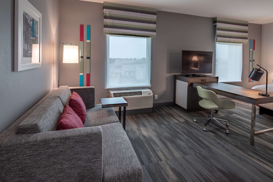 Suite, 1 King Bed, Accessible, Refrigerator & Microwave (Hearing) | Desk, laptop workspace, blackout drapes, iron/ironing board