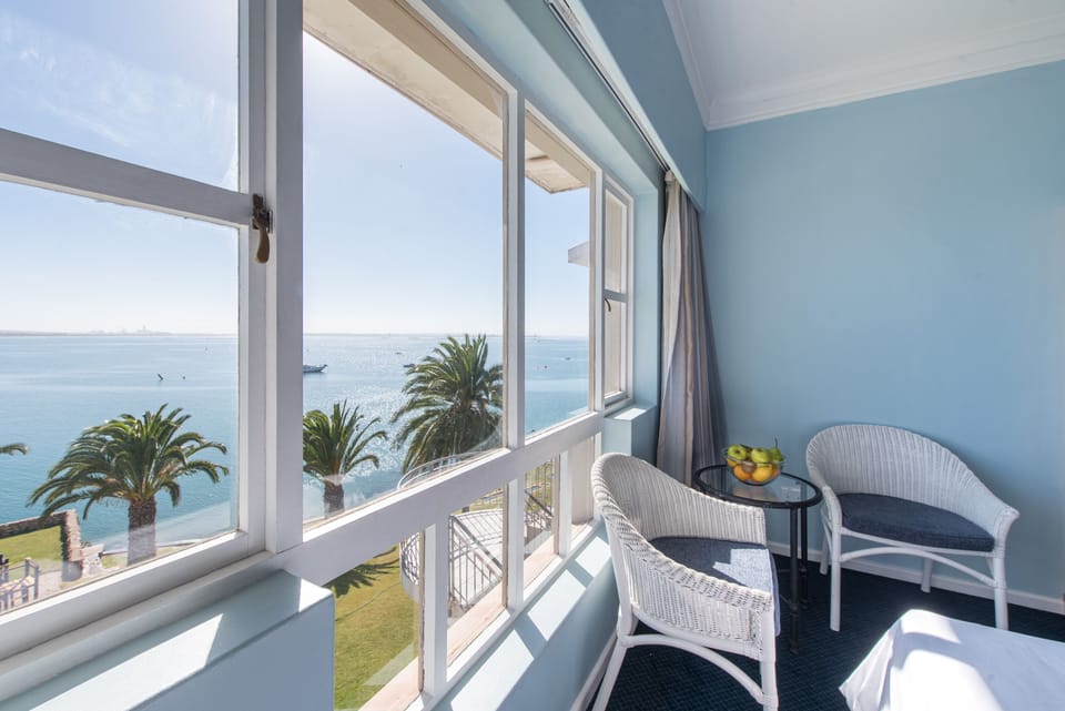 Family Room, Sea View | Minibar, in-room safe, desk, laptop workspace