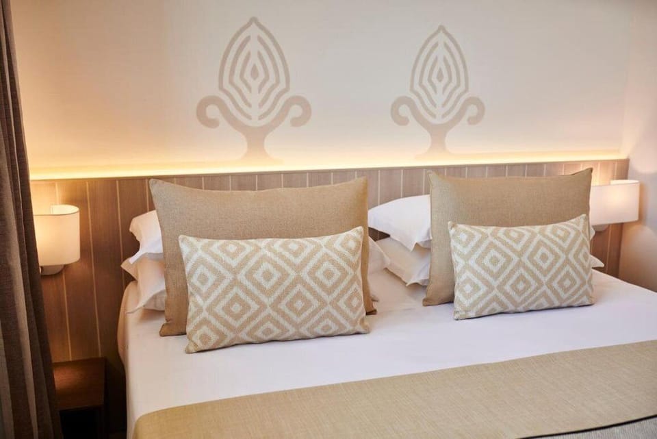 Family Quadruple Room | Down comforters, in-room safe, desk, laptop workspace