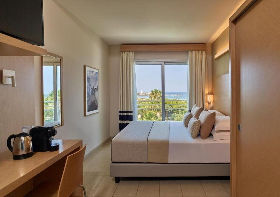 Junior Suite, Sea View | Down comforters, in-room safe, desk, laptop workspace