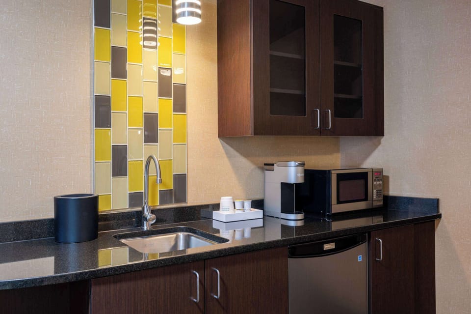 Desk, laptop workspace, blackout drapes, iron/ironing board