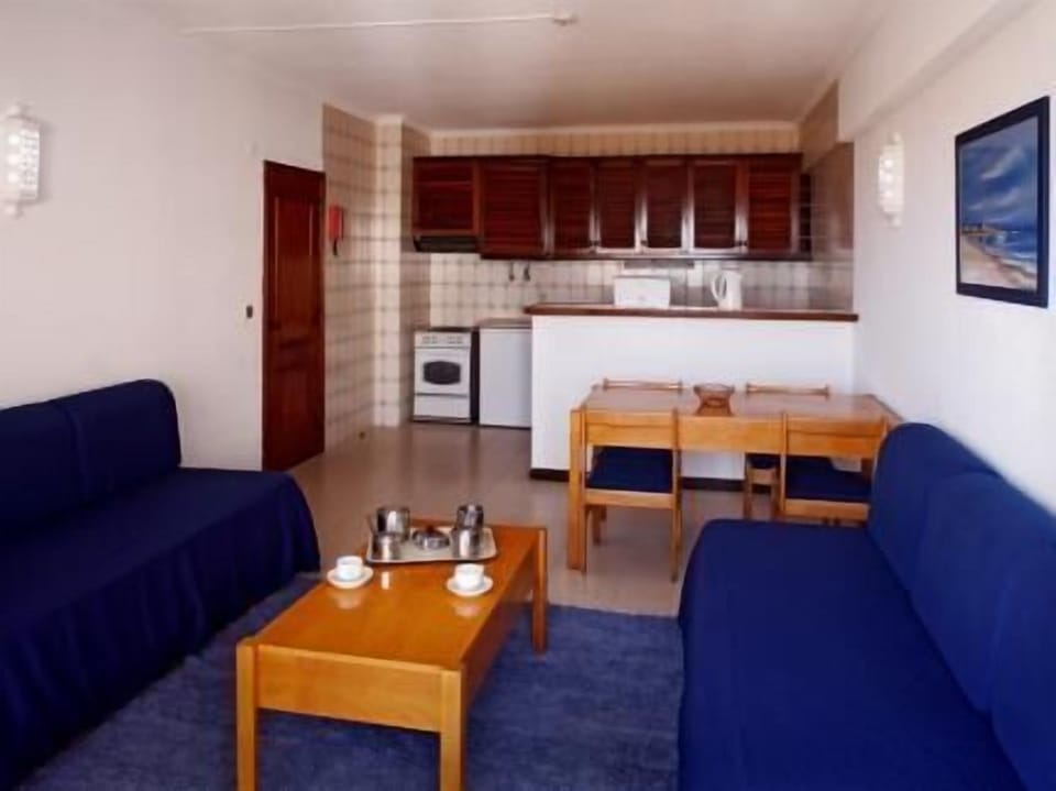 Apartment, 2 Bedrooms | Living area | 28-inch TV with cable channels