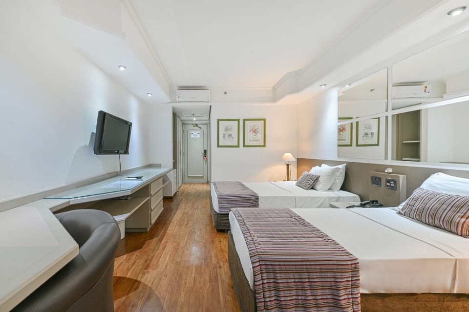 Standard Twin Room | Minibar, in-room safe, desk, blackout drapes