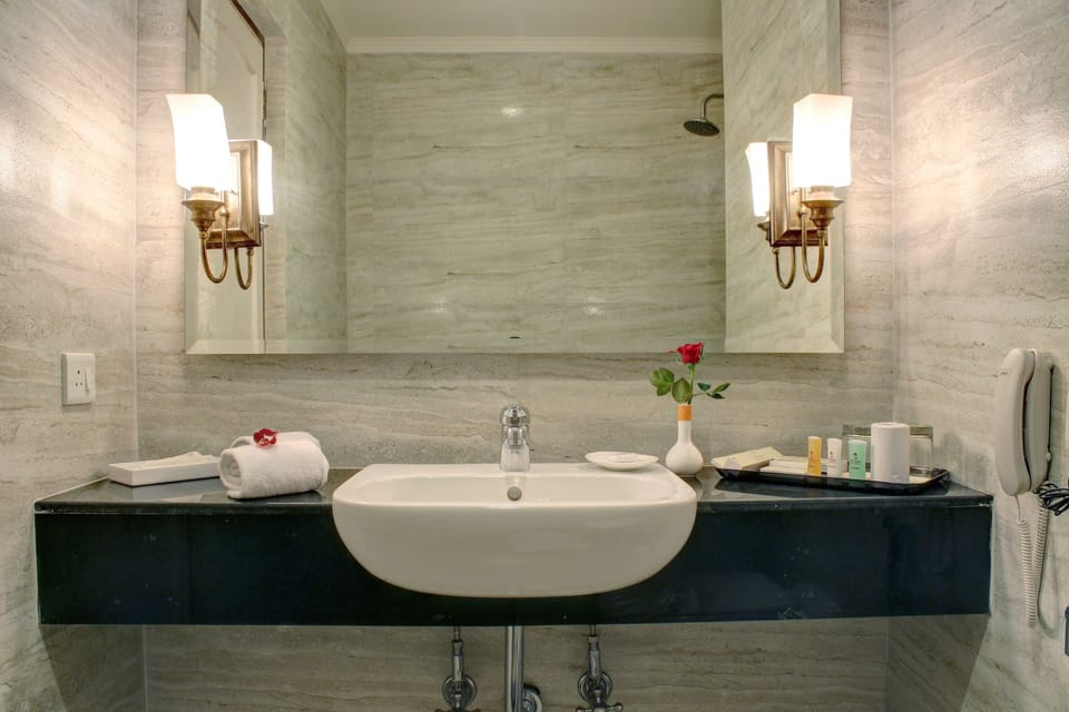 Lotus Room King Bed | Bathroom | Shower, rainfall showerhead, free toiletries, hair dryer