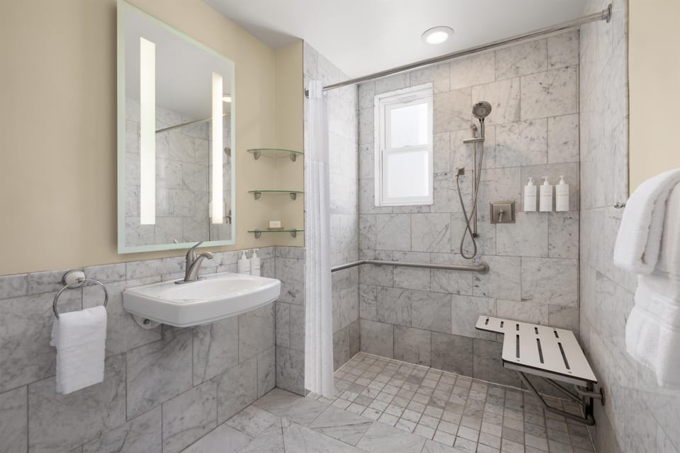 Designer toiletries, hair dryer, towels, soap