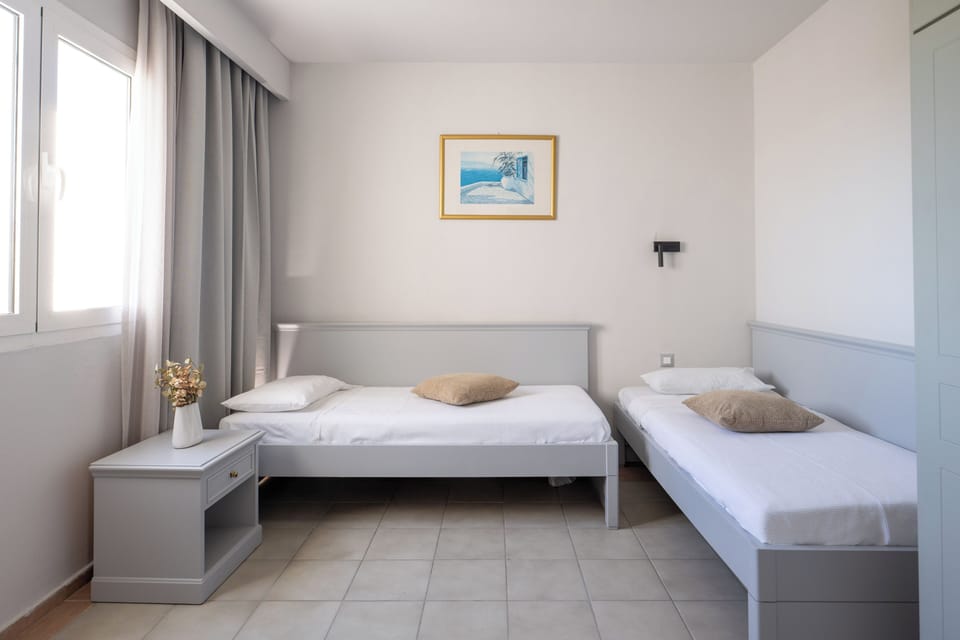 Family Room, Garden View | In-room safe, blackout drapes, free WiFi, bed sheets