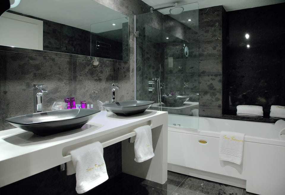 Combined shower/tub, free toiletries, hair dryer, slippers