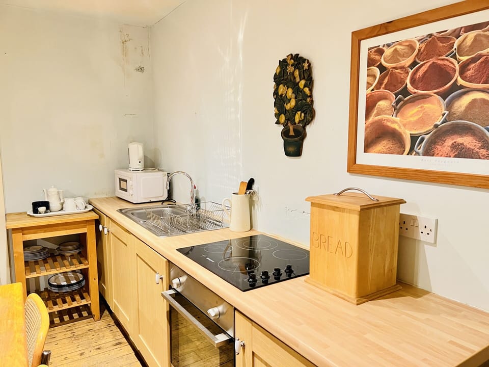 Comfort Room, Ensuite, Garden View | Private kitchen | Highchair