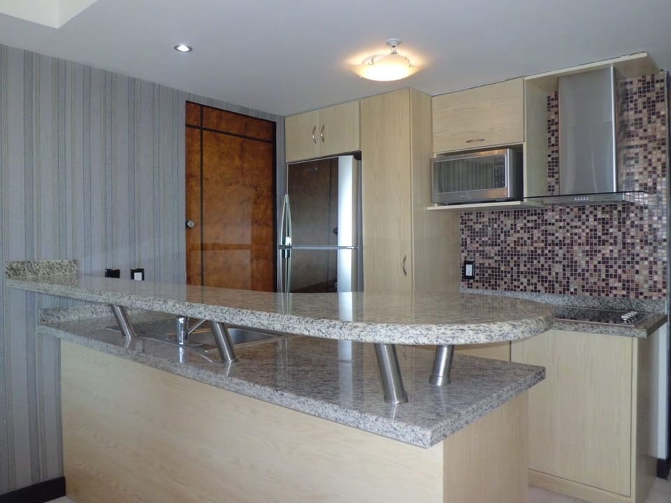 Family Condo, 2 Bedrooms | Private kitchen | Full-size fridge, microwave, stovetop, coffee/tea maker