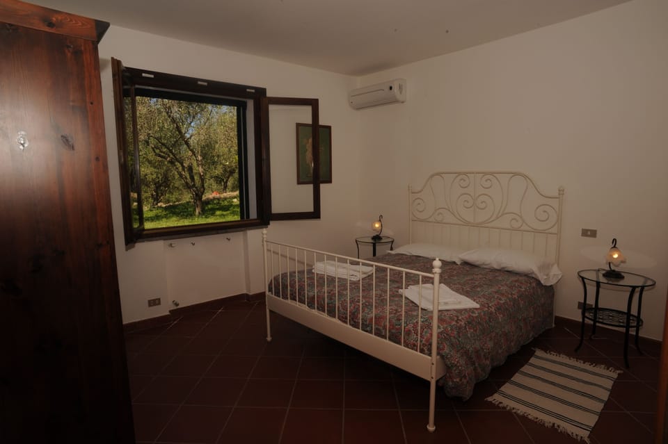 Comfort Apartment, 2 Bedrooms, Patio (Ginestra) | Desk, blackout drapes, iron/ironing board, free cribs/infant beds