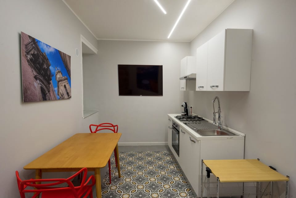 Romantic Apartment, 1 Queen Bed, Non Smoking, City View | Private kitchen | Full-size fridge, cleaning supplies