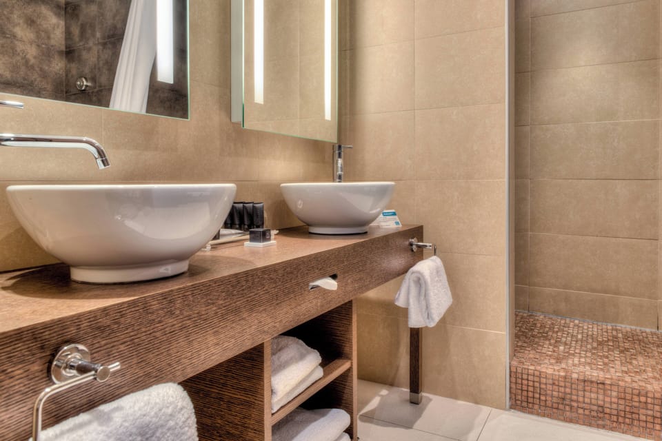 Suite, 1 Queen Bed with Sofa bed, Balcony, Partial Sea View (Balcony) | Bathroom | Eco-friendly toiletries, hair dryer, towels