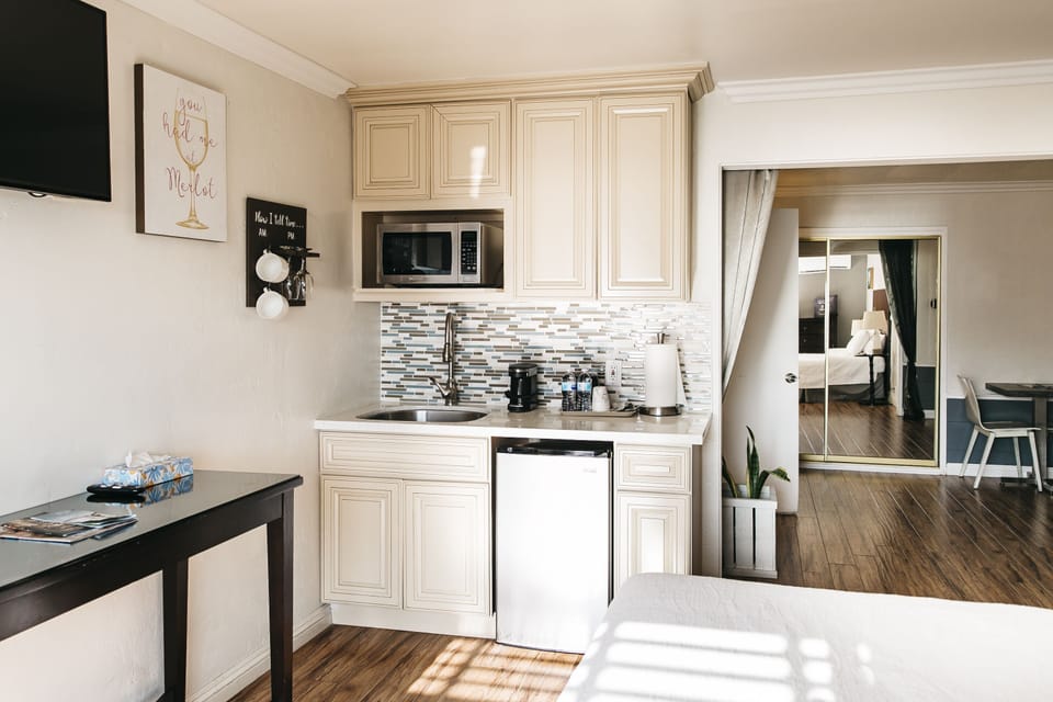 Junior Suite with Balcony | Private kitchen | Coffee/tea maker, mini-fridge, microwave (on request), toaster