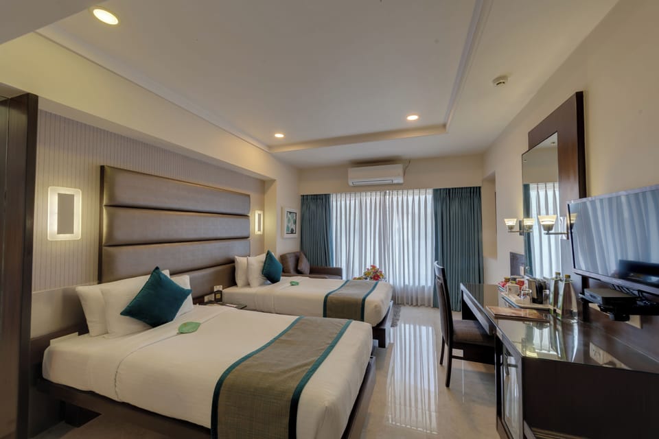 Deluxe Double Room | Pillowtop beds, in-room safe, desk, blackout drapes