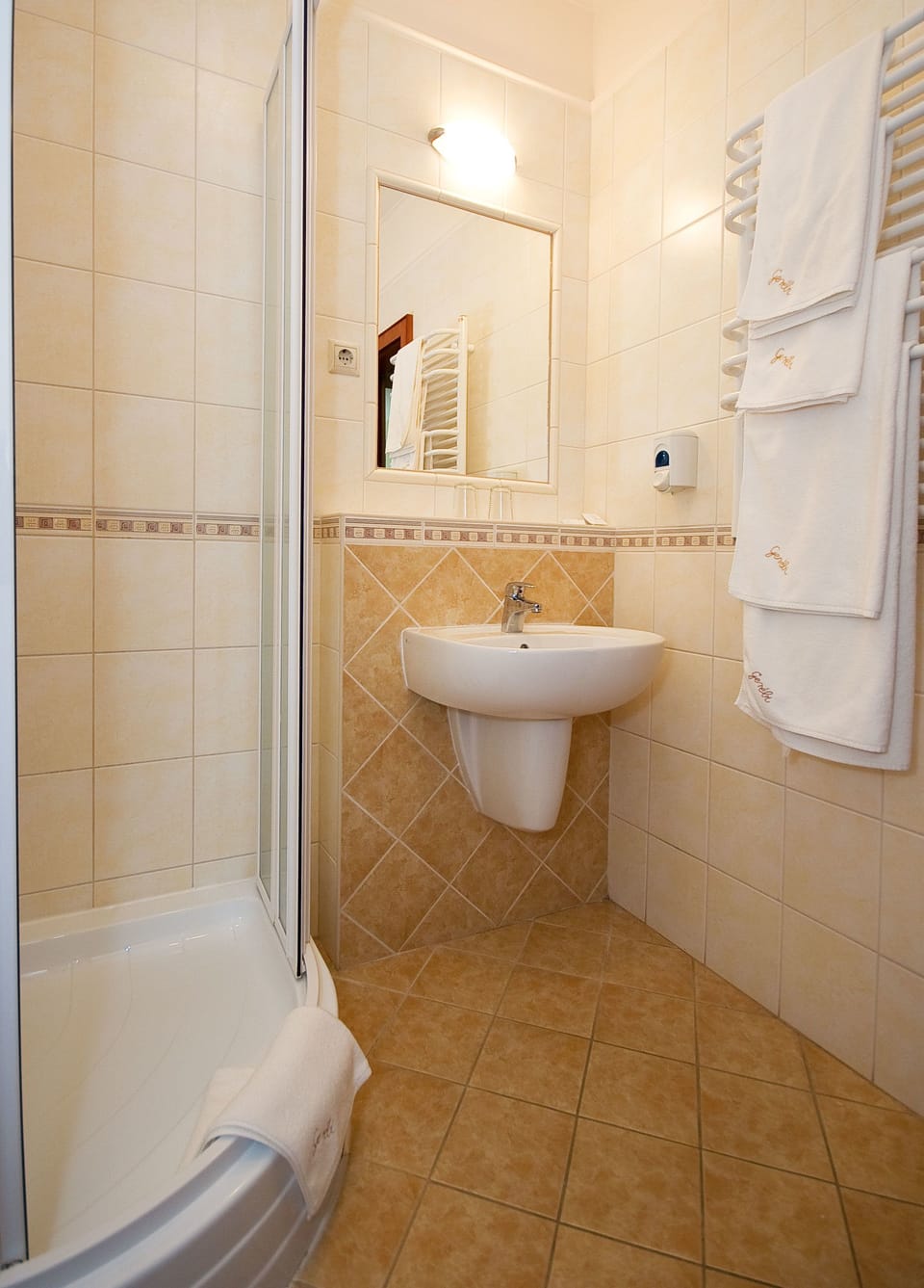 Shower, free toiletries, hair dryer, slippers