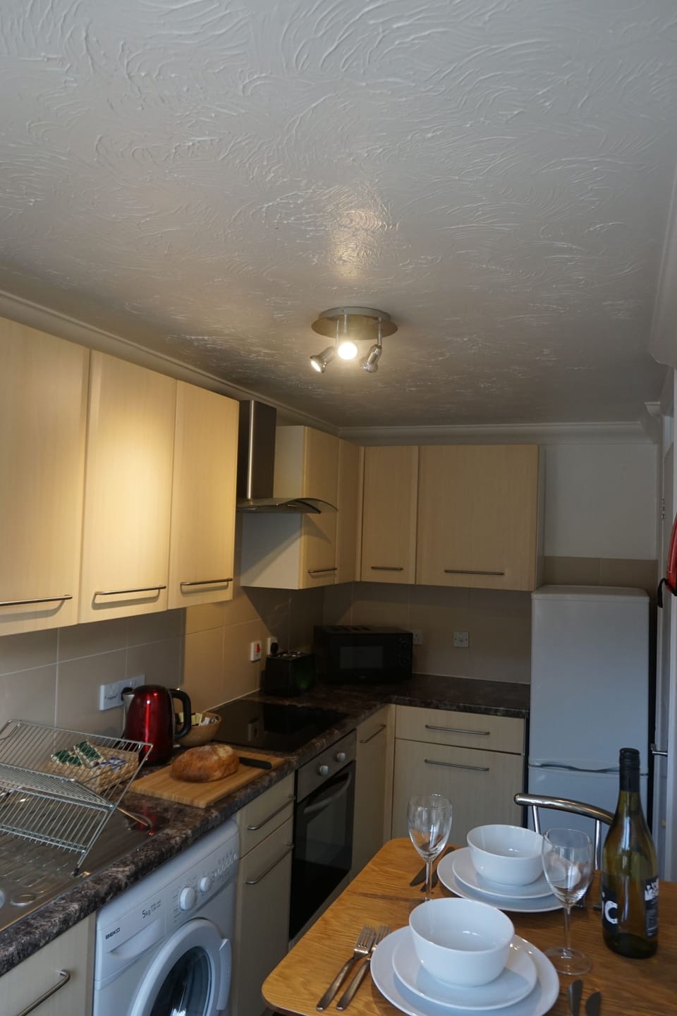 Business Apartment, Multiple Bedrooms | Private kitchen | Full-size fridge, microwave, oven, stovetop