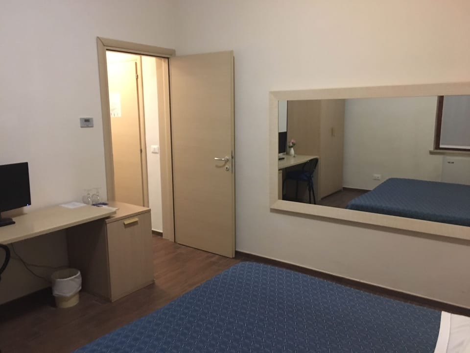 Economy Double Room | Minibar, in-room safe, desk, rollaway beds