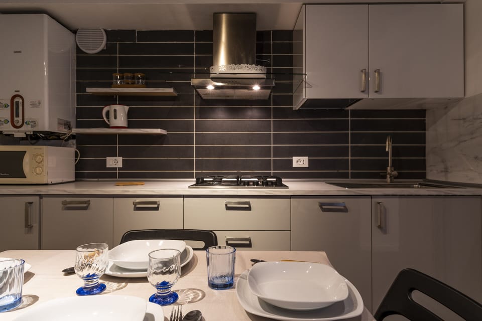 Apartment, 2 Bedrooms | Private kitchenette | Full-size fridge, microwave, stovetop, dishwasher