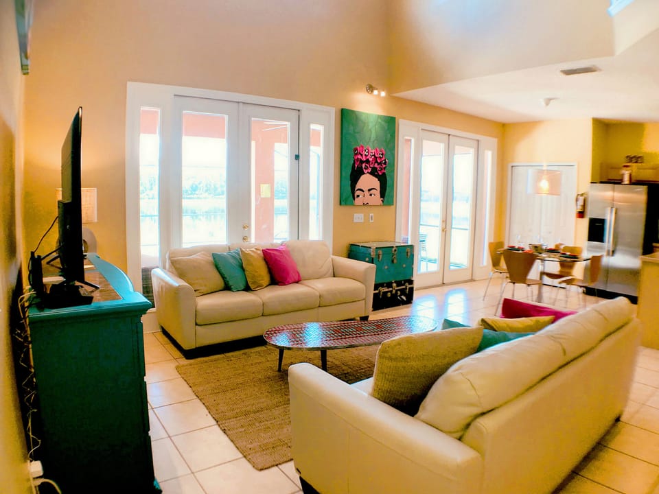 Deluxe Villa, Multiple Bedrooms, Pool Access | Living room | Flat-screen TV, DVD player