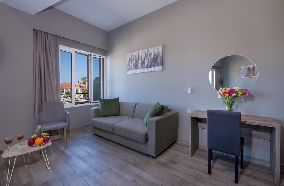 Superior Studio Suite | Living area | 24-inch Smart TV with satellite channels, TV