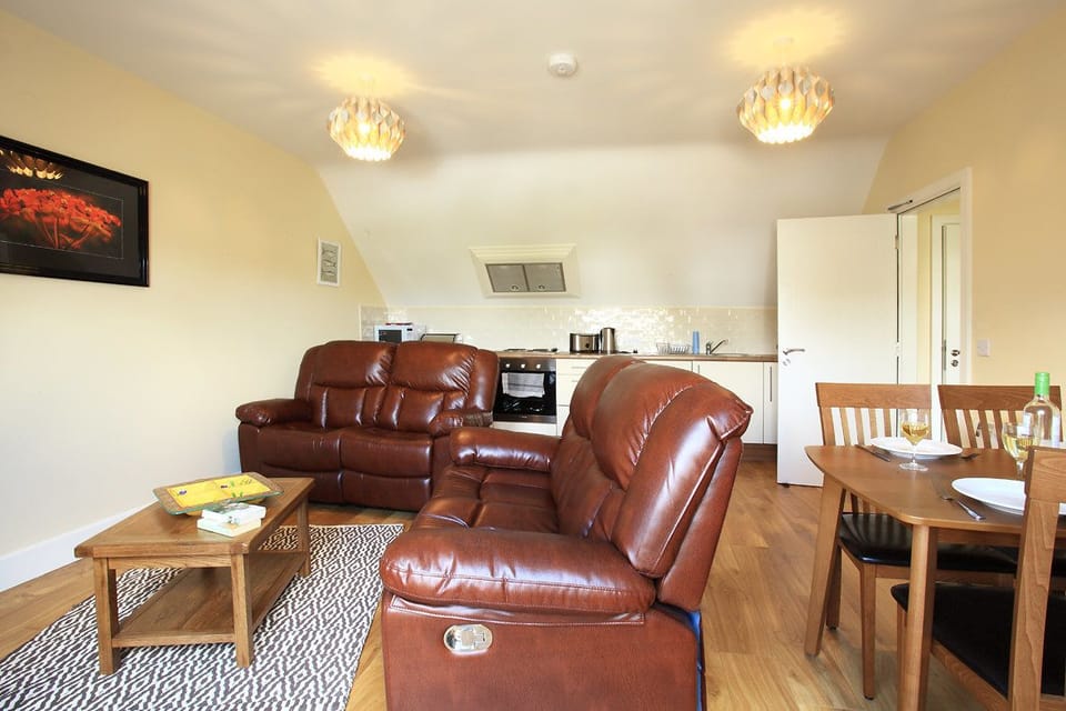 Deluxe Apartment, 2 Bedrooms | Living area | Flat-screen TV