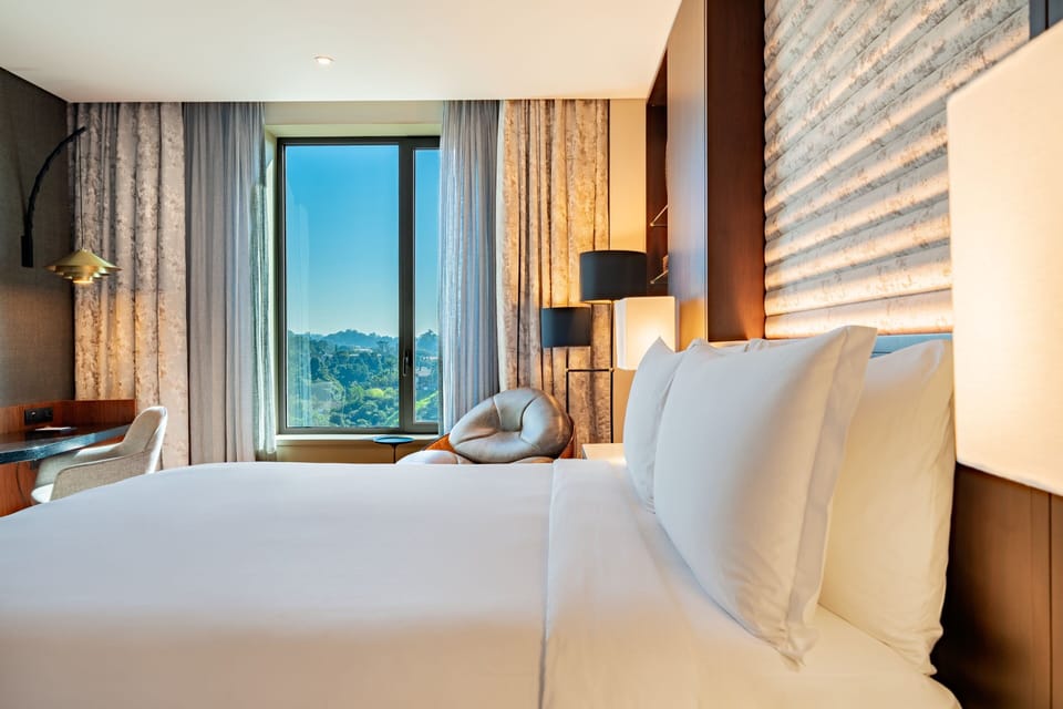 Premium bedding, down comforters, minibar, in-room safe