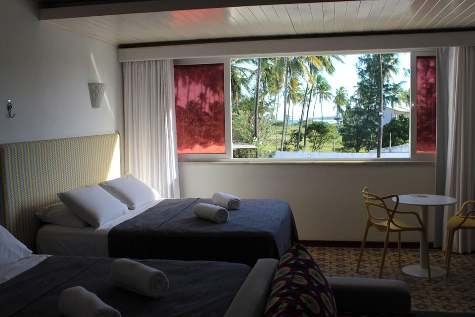 Quarto Quadruplo | 1 bedroom, pillowtop beds, minibar, in-room safe