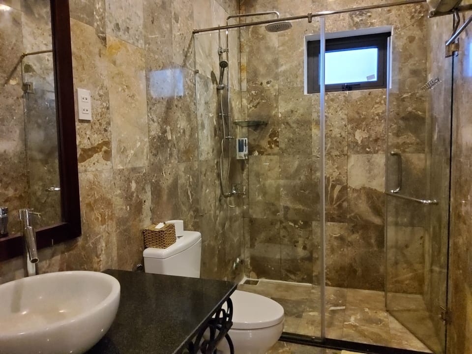 Shower, free toiletries, hair dryer, slippers