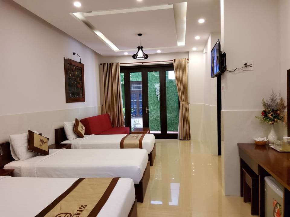 Deluxe Family Room, Balcony | Minibar, desk, free WiFi, bed sheets