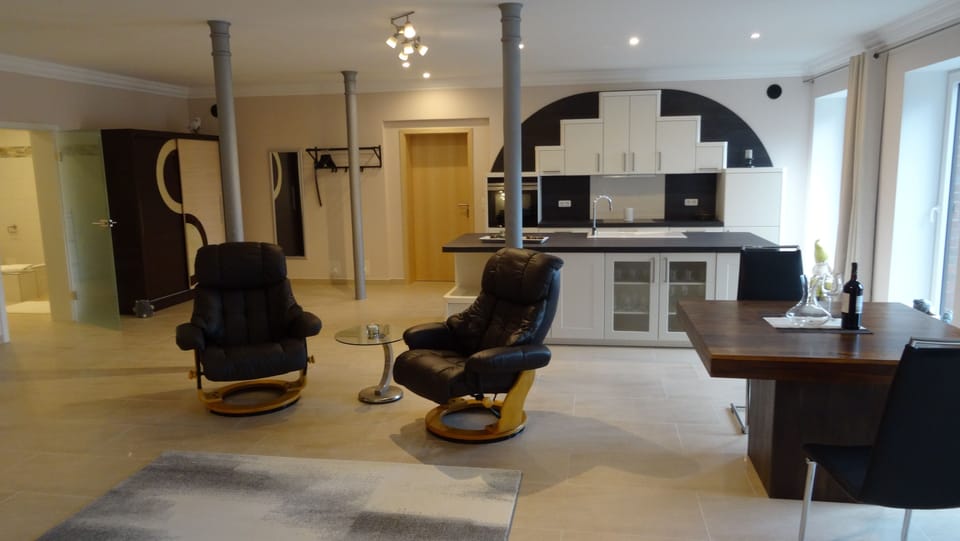 Comfort Suite, 2 Queen Beds, Non Smoking, Courtyard View | Living room | 55-inch flat-screen TV with satellite channels, TV, iPod dock